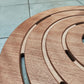 Piatto doccia rotondo in legno Okumé per esterno, diametro 59 cm, resistente e di alta qualità. Acquista ora per un design elegante e duraturo.